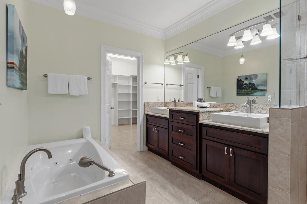 64 Dolphin Street Destin, FL 32541 - Photo 69 of 107 a bathroom with a sink double vanity and a tub