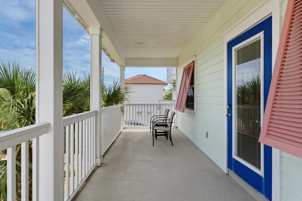64 Dolphin Street Destin, FL 32541 - Photo 75 of 107 a view of a balcony with furniture