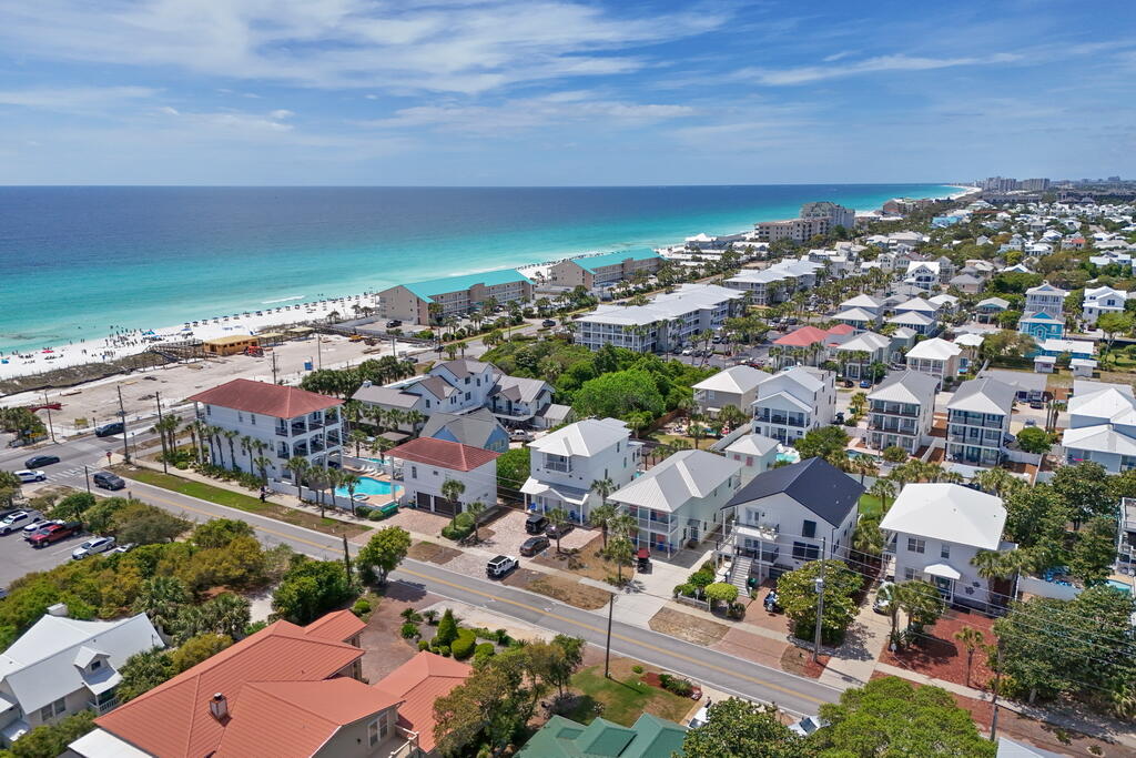 64 Dolphin Street Destin, FL 32541 - Photo 100 of 107 an aerial view of a city and ocean