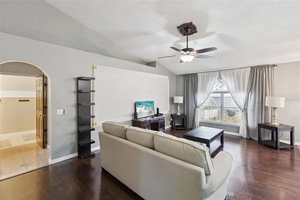 a living room with furniture and a large window