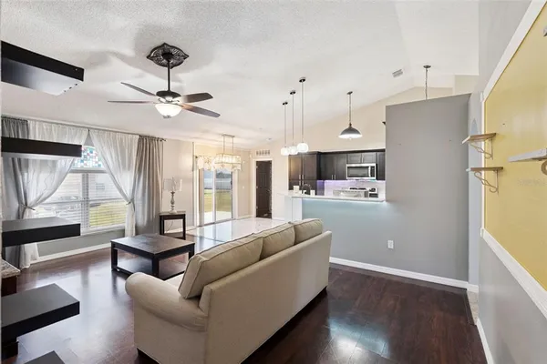 a living room with furniture and a large window