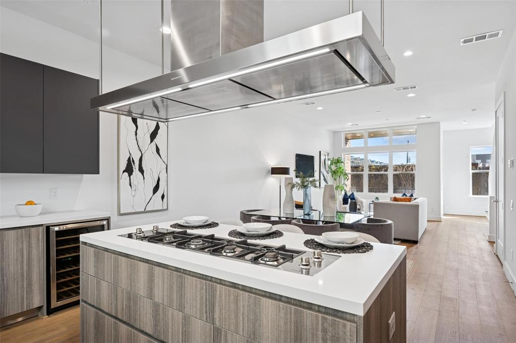 3064 ChImes Street Dallas, TX 75219 - Photo 12 of 40 a kitchen with a stove and a table