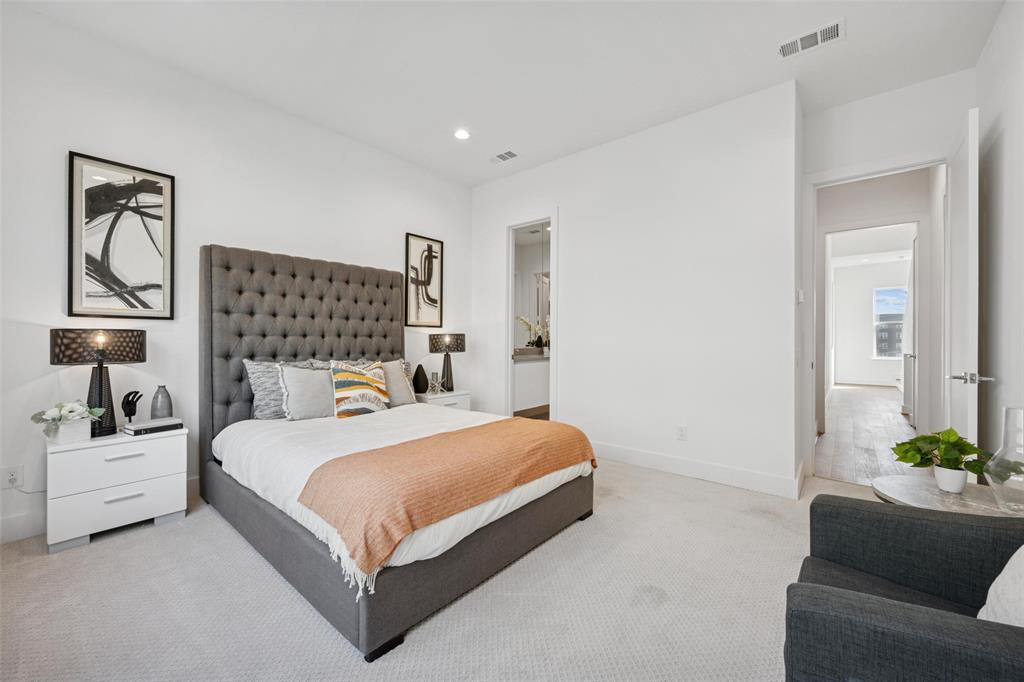 3064 ChImes Street Dallas, TX 75219 - Photo 13 of 40 a bedroom with a large bed couch and a window
