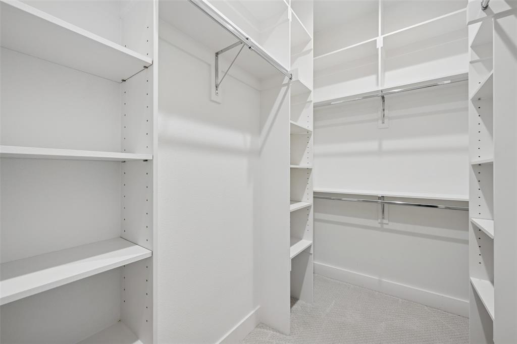 3064 ChImes Street Dallas, TX 75219 - Photo 18 of 40 a view of walk in closet with empty racks