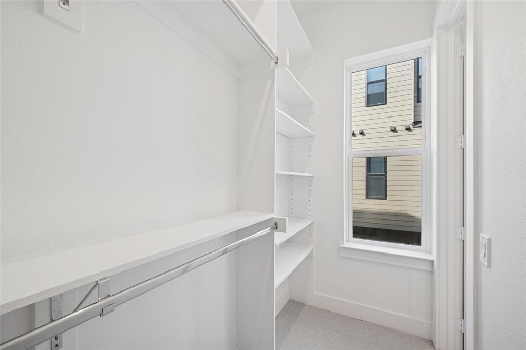 3064 ChImes Street Dallas, TX 75219 - Photo 19 of 40 a view of an empty walk in closet