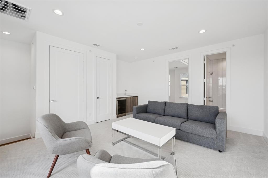 3064 ChImes Street Dallas, TX 75219 - Photo 20 of 40 a living room with furniture and a couch