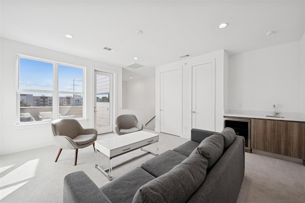 3064 ChImes Street Dallas, TX 75219 - Photo 21 of 40 a living room with furniture and a large window