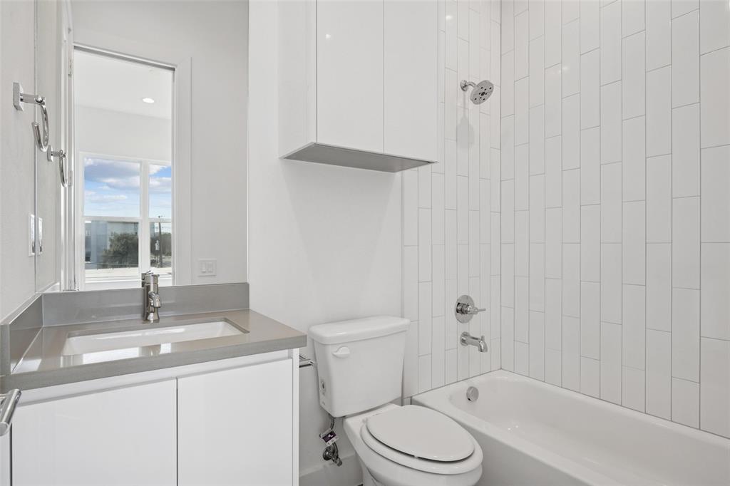 3064 ChImes Street Dallas, TX 75219 - Photo 24 of 40 a bathroom with a sink a toilet and shower
