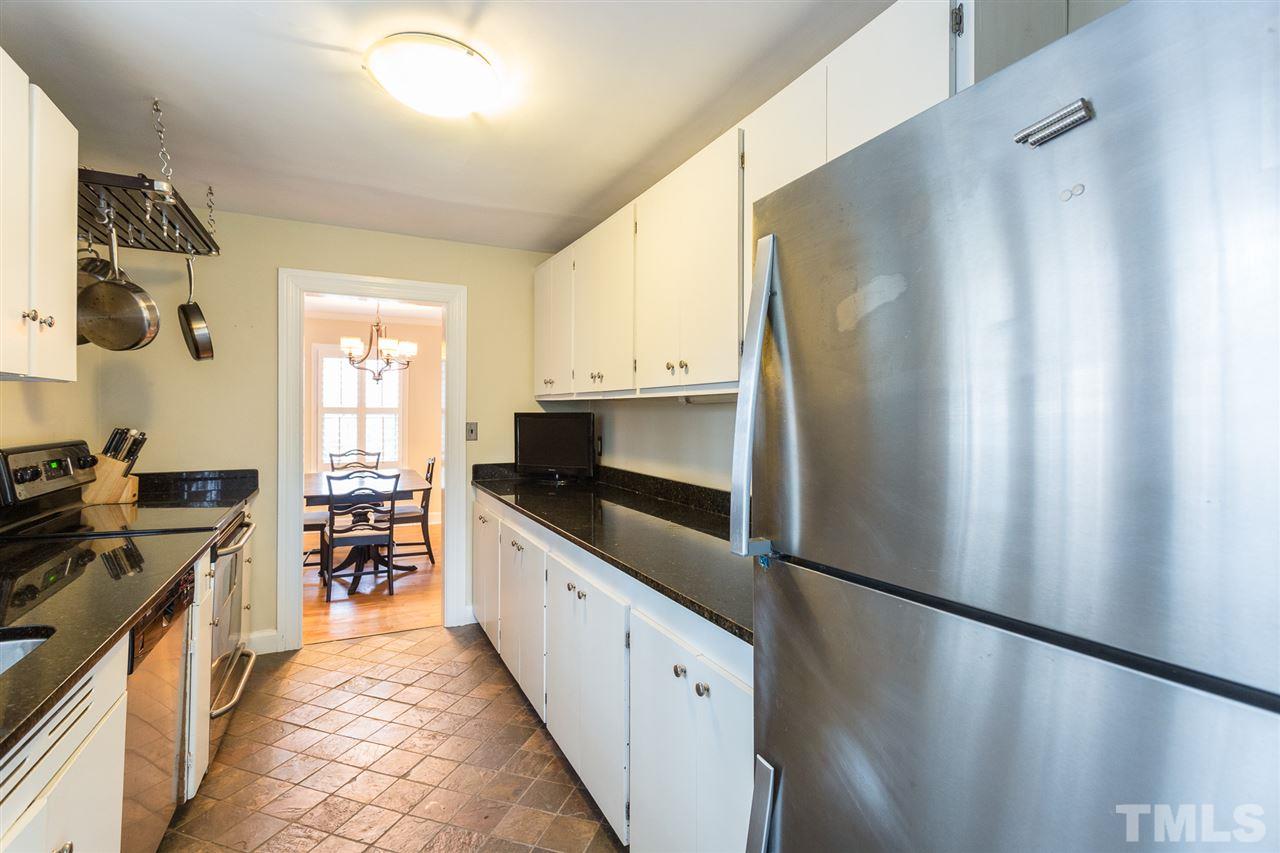 3008 Medlin Drive Raleigh, NC 27607 - Photo 11 of 29 a kitchen with stainless steel appliances a refrigerator and a stove top oven