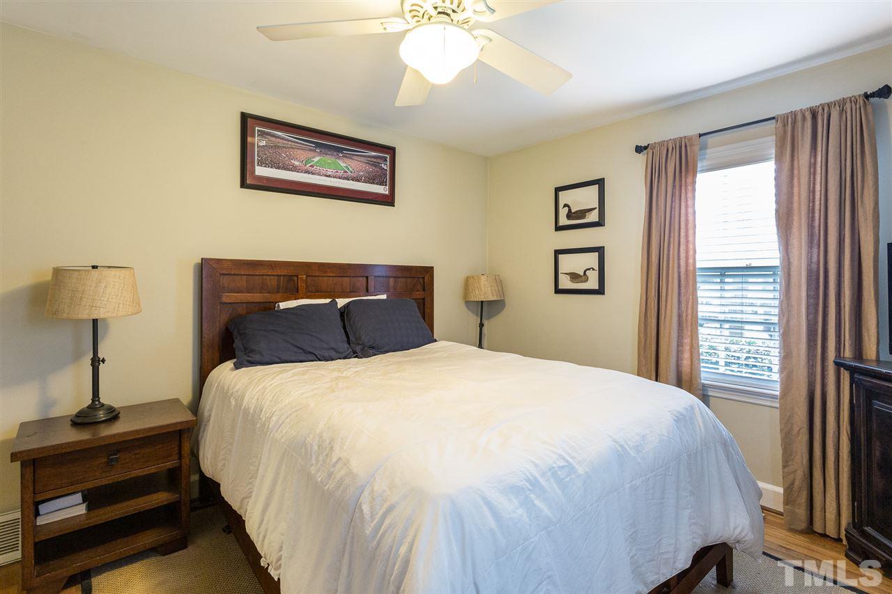 3008 Medlin Drive Raleigh, NC 27607 - Photo 16 of 29 a bedroom with a bed and a window