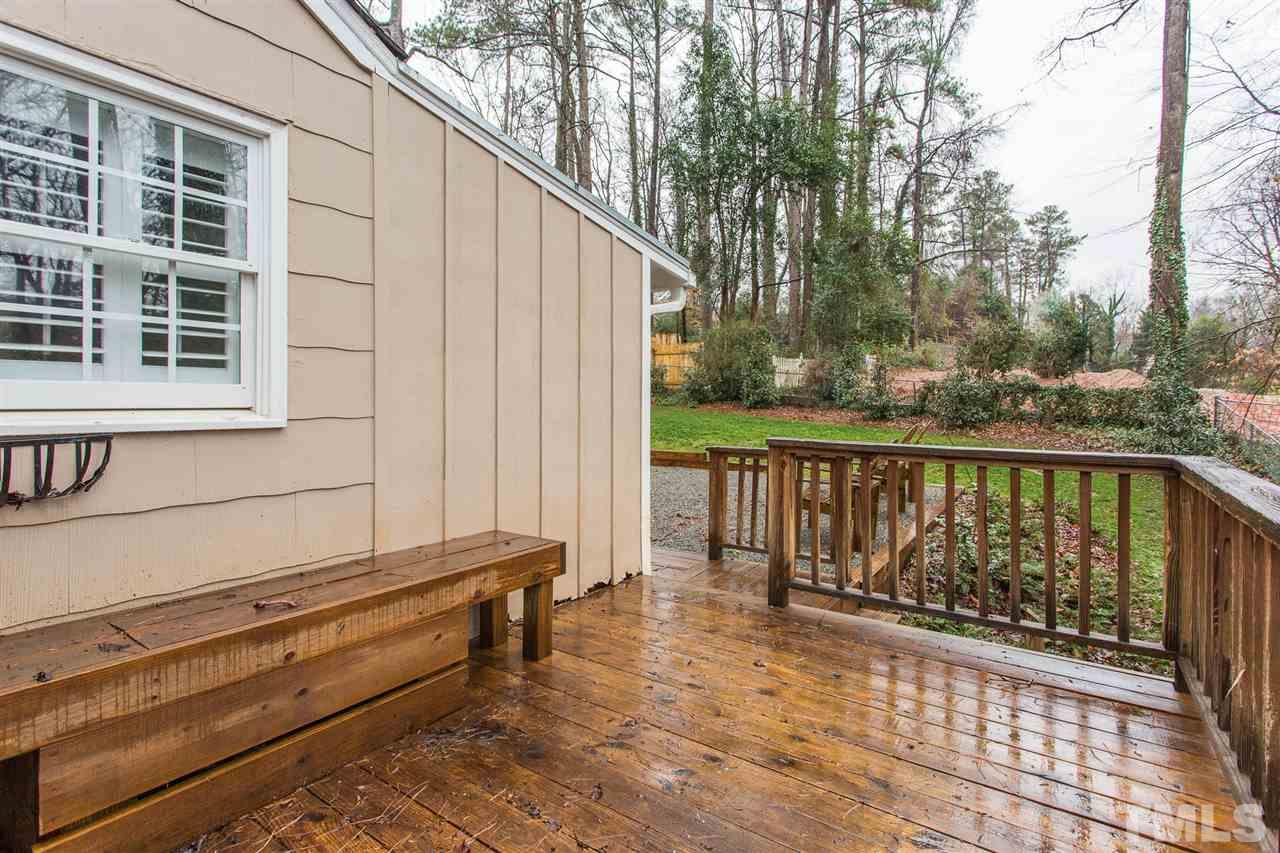 3008 Medlin Drive Raleigh, NC 27607 - Photo 25 of 29 a roof deck with wooden floor and fence