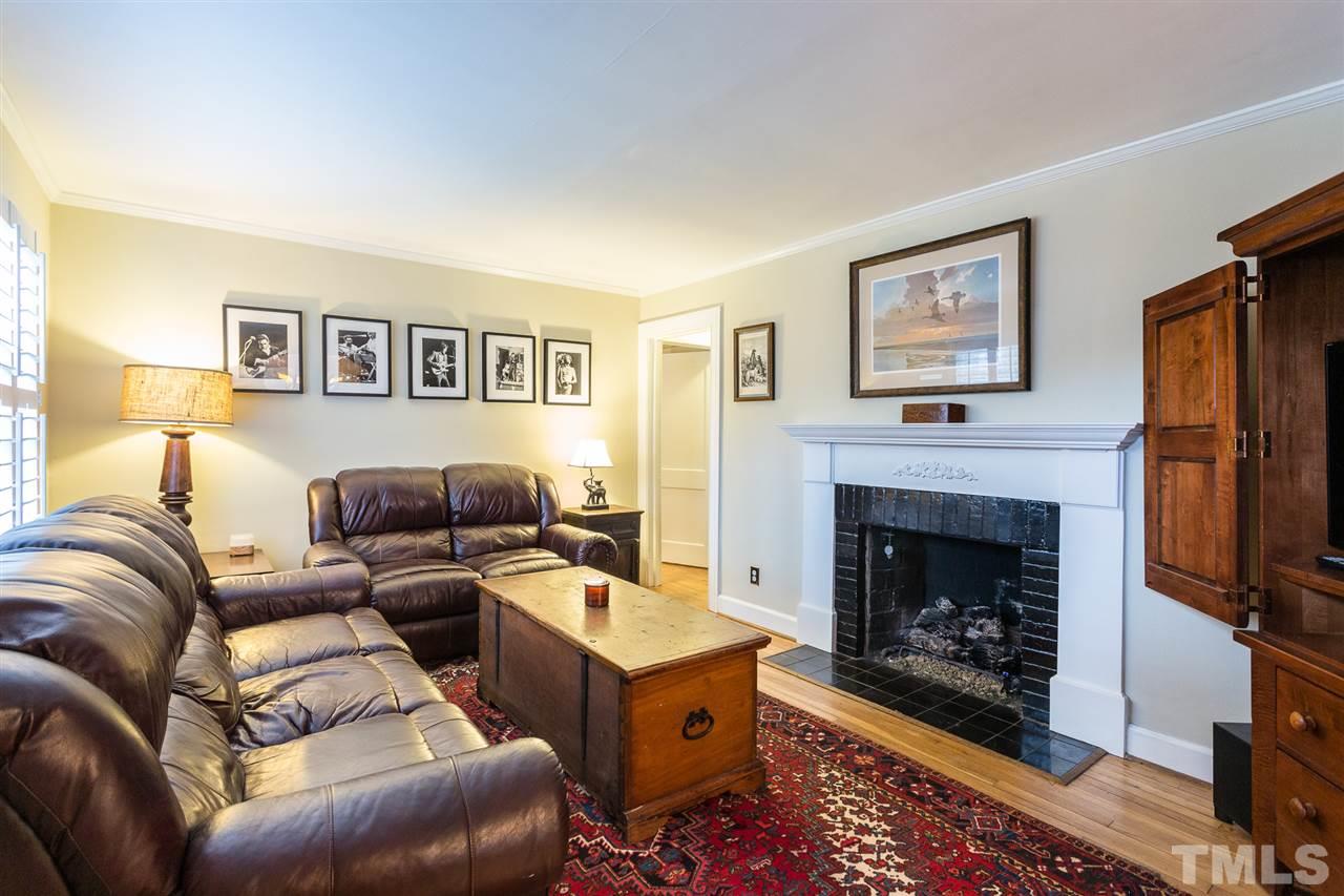 3008 Medlin Drive Raleigh, NC 27607 - Photo 4 of 29 a living room with furniture and a fireplace