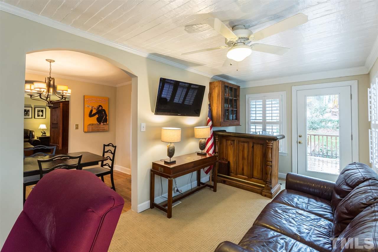 3008 Medlin Drive Raleigh, NC 27607 - Photo 9 of 29 a living room with furniture and a flat screen tv