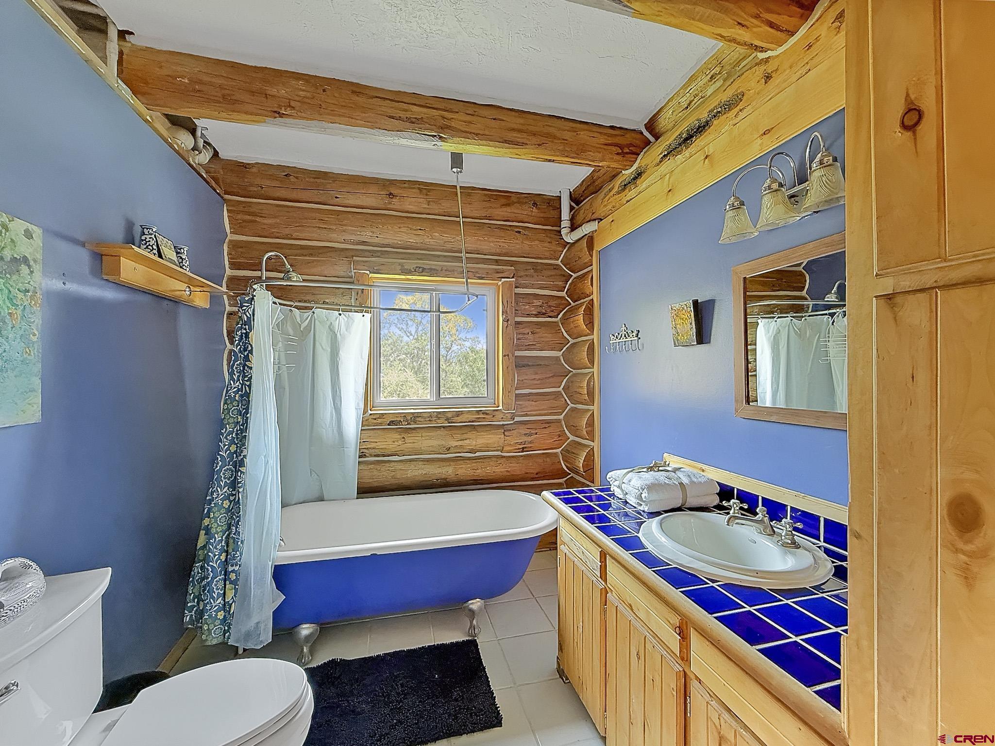 41263 Highway 133 Paonia, CO 81428 - Photo 27 of 44 a bathroom with a toilet sink and mirror