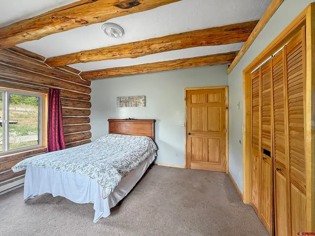 a view of a lake with mountains in background