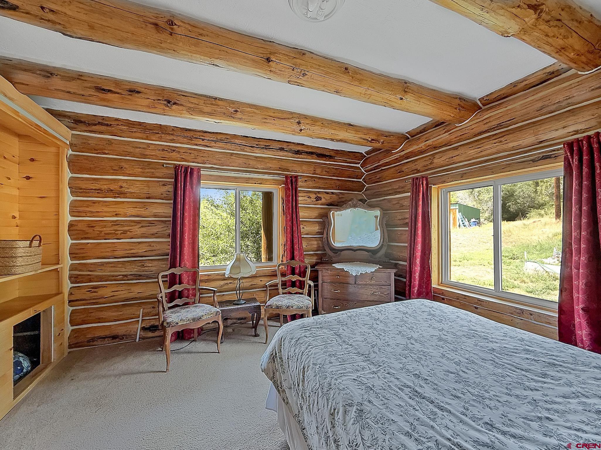 41263 Highway 133 Paonia, CO 81428 - Photo 31 of 44 a bed room with a bed and a window