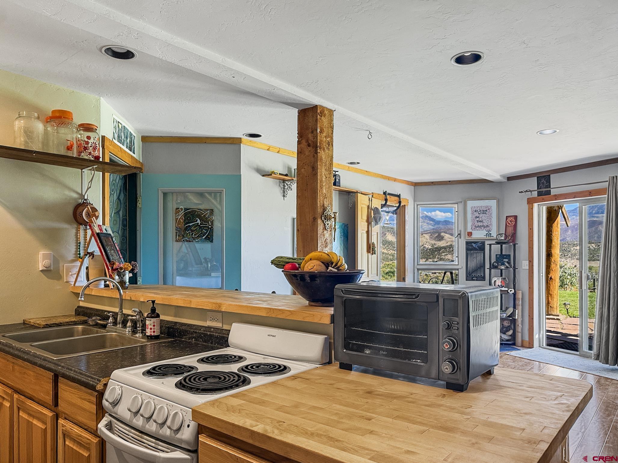 41263 Highway 133 Paonia, CO 81428 - Photo 35 of 44 a kitchen with stainless steel appliances granite countertop a stove and a sink