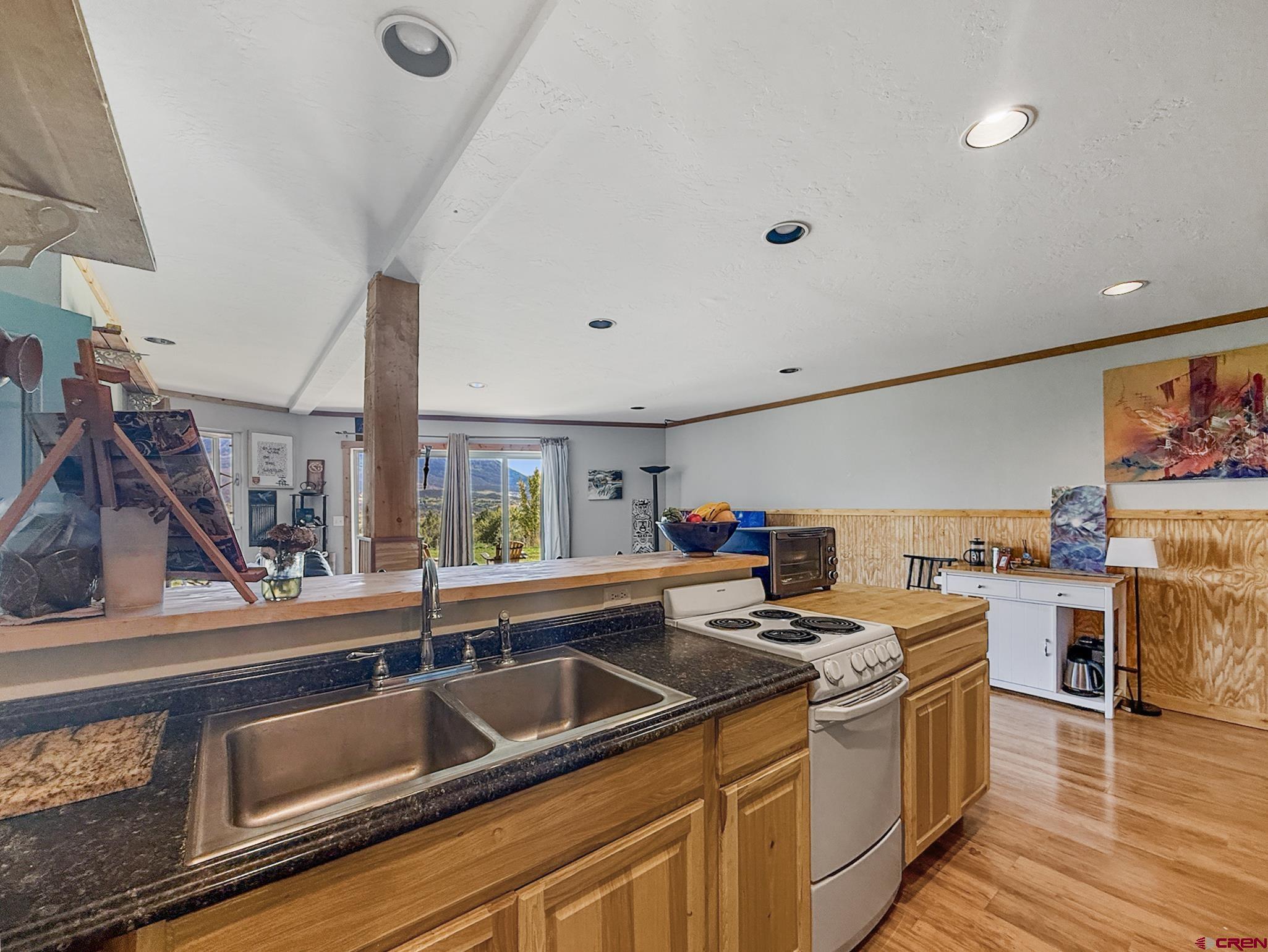 41263 Highway 133 Paonia, CO 81428 - Photo 36 of 44 a kitchen with stainless steel appliances granite countertop a sink and a stove