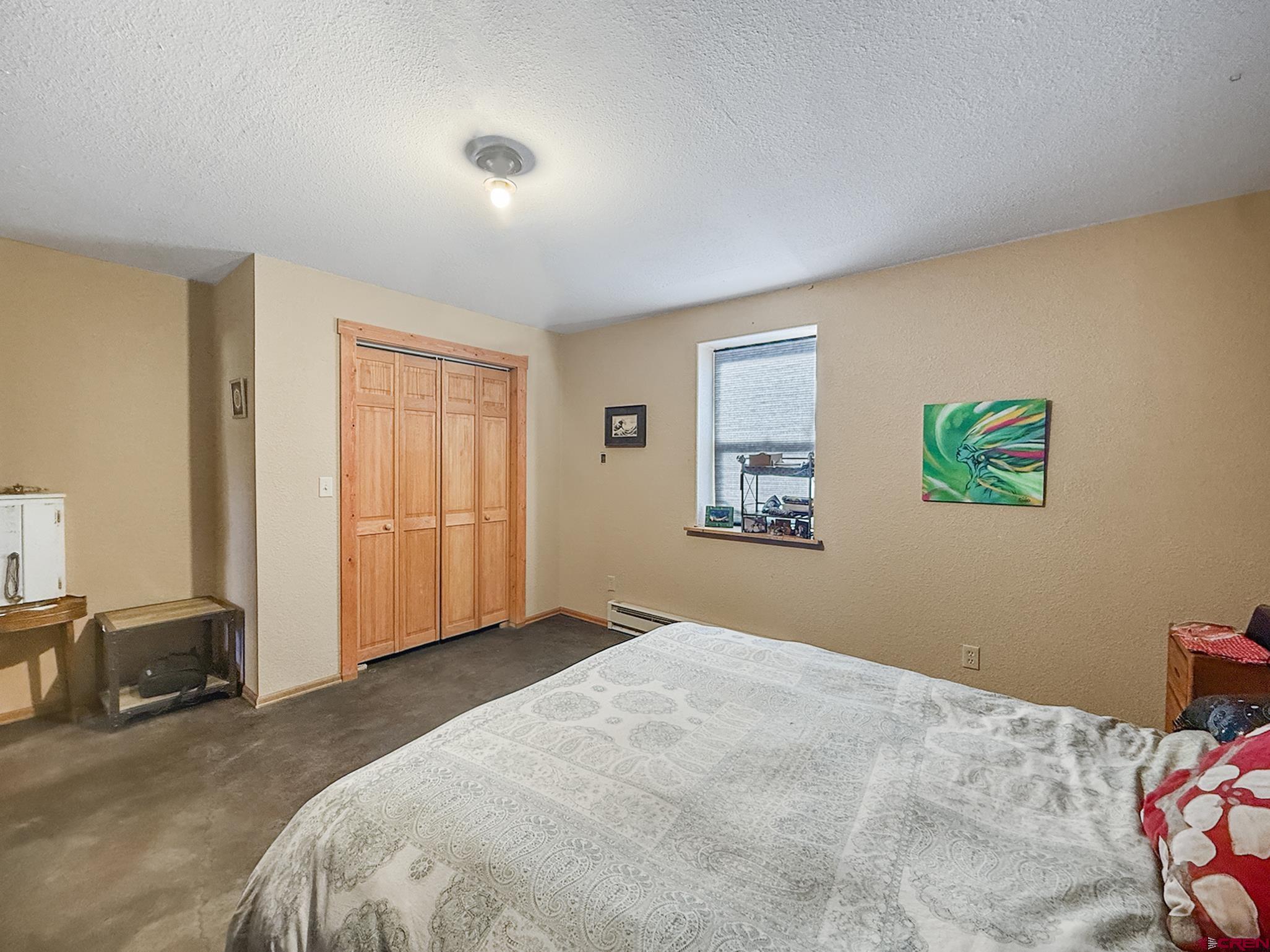 41263 Highway 133 Paonia, CO 81428 - Photo 38 of 44 a bedroom with a bed and a couch