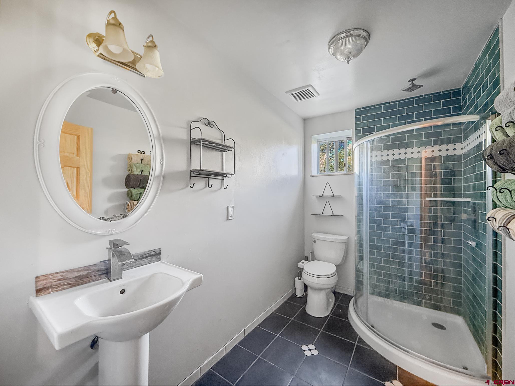 41263 Highway 133 Paonia, CO 81428 - Photo 39 of 44 a bathroom with a sink a toilet and shower