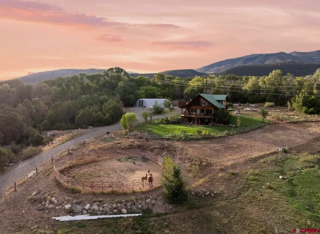 a view of a town with mountains in the background