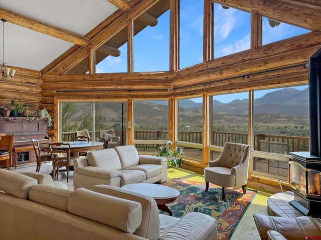 a view of a kitchen with kitchen island table and chairs