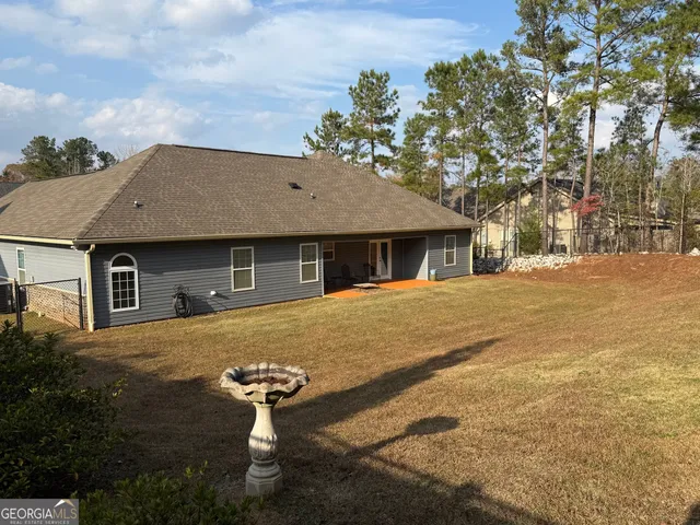 a front view of a house with yard