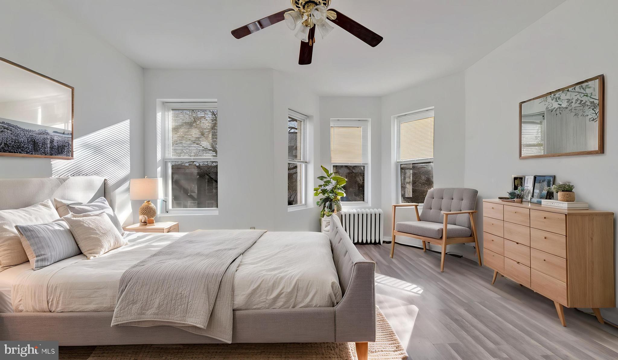 1528 E Street Southeast Washington, DC 20003 - Photo 11 of 19 a bedroom with a large bed and furniture