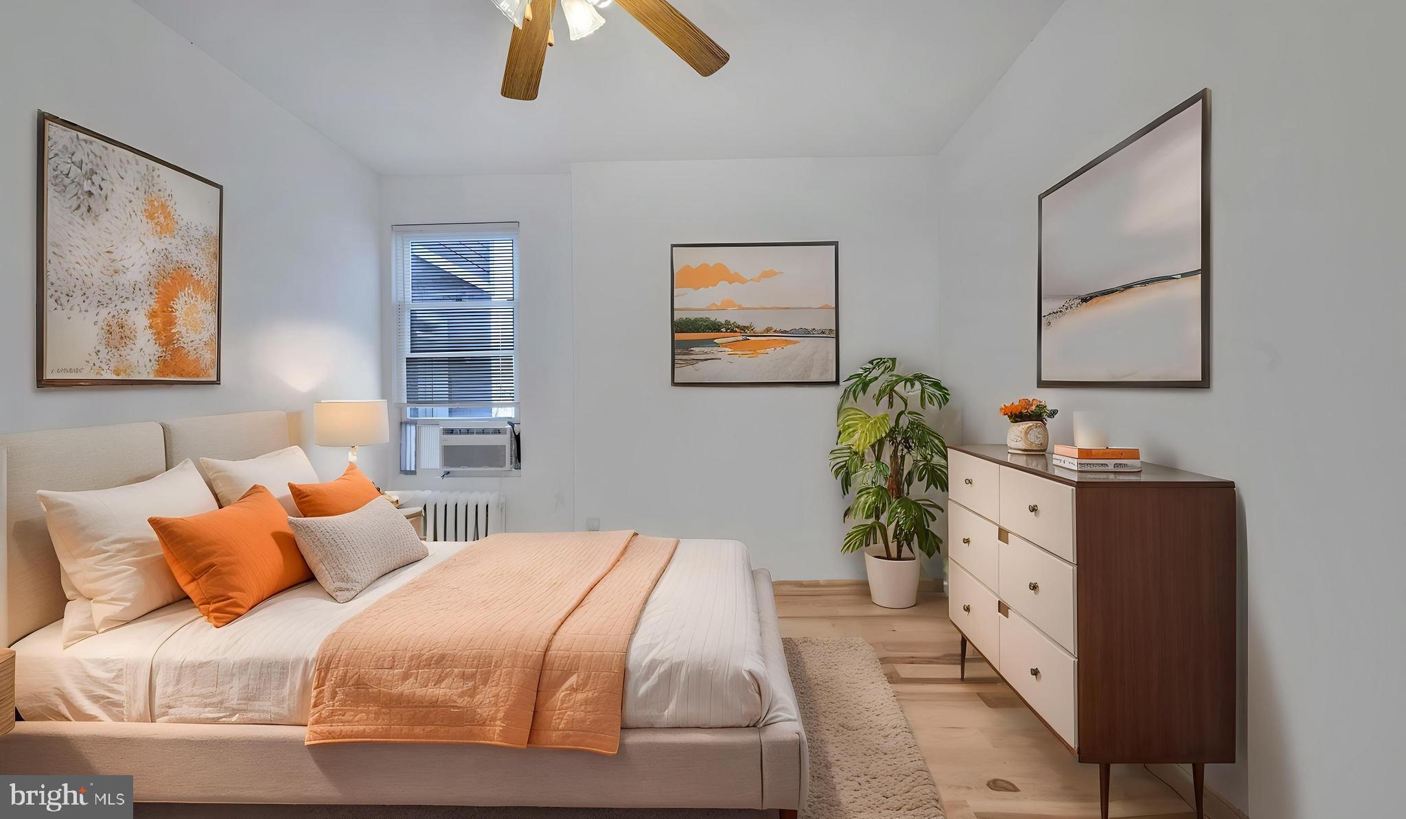 1528 E Street Southeast Washington, DC 20003 - Photo 14 of 19 a bedroom with furniture and a chandelier