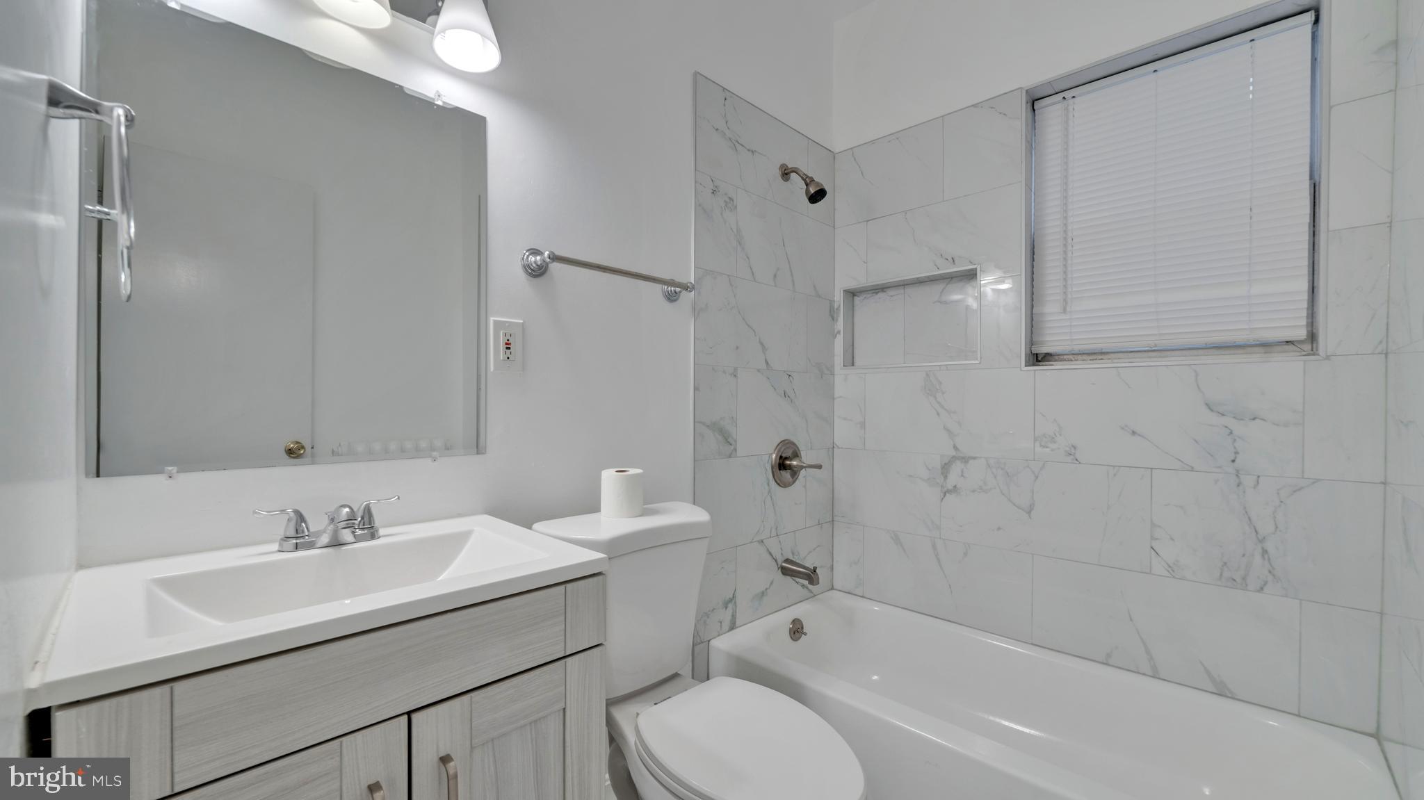 1528 E Street Southeast Washington, DC 20003 - Photo 17 of 19 a bathroom with a sink toilet tub and shower