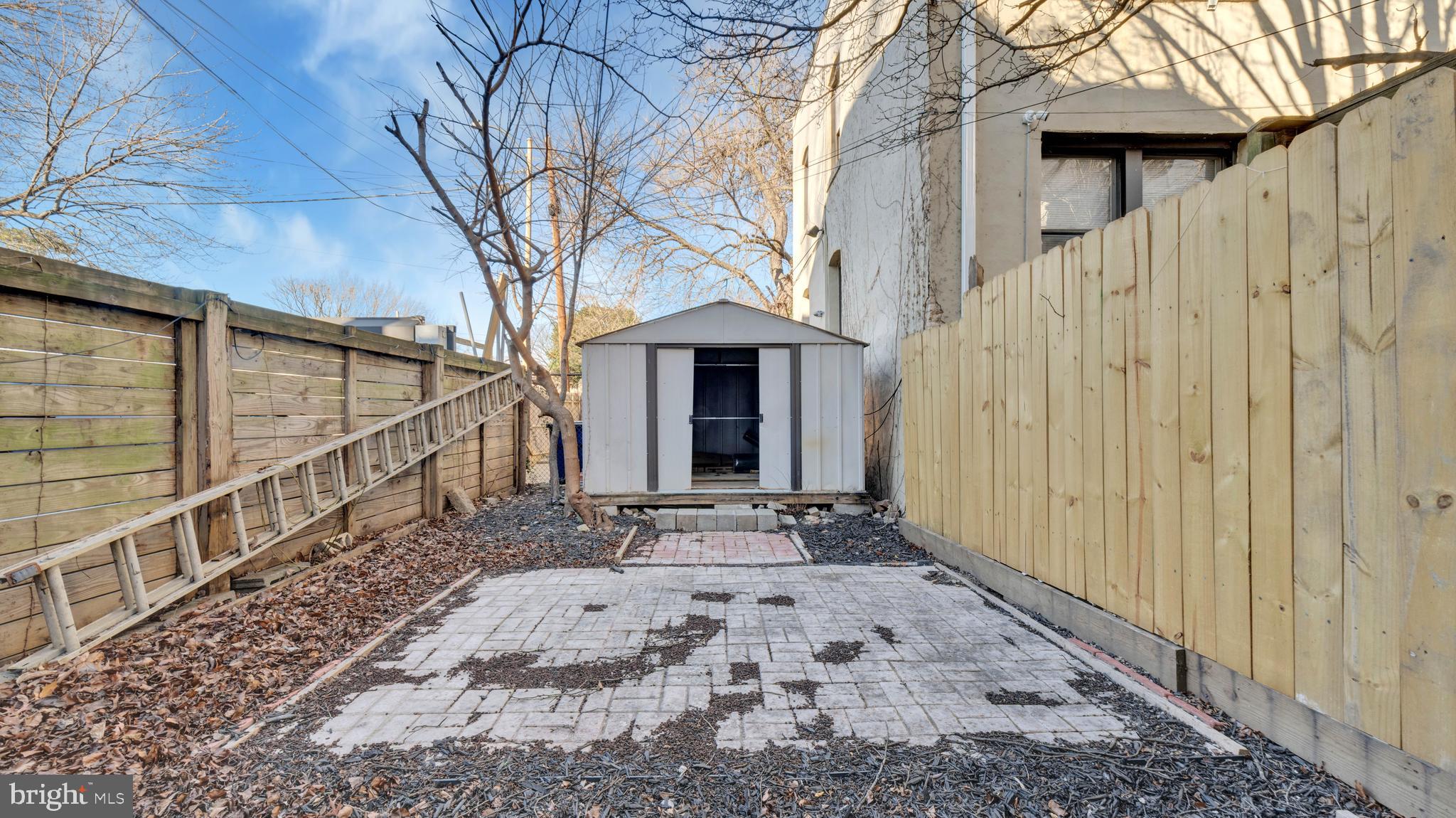 1528 E Street Southeast Washington, DC 20003 - Photo 18 of 19 a front view of a house with a yard and garage