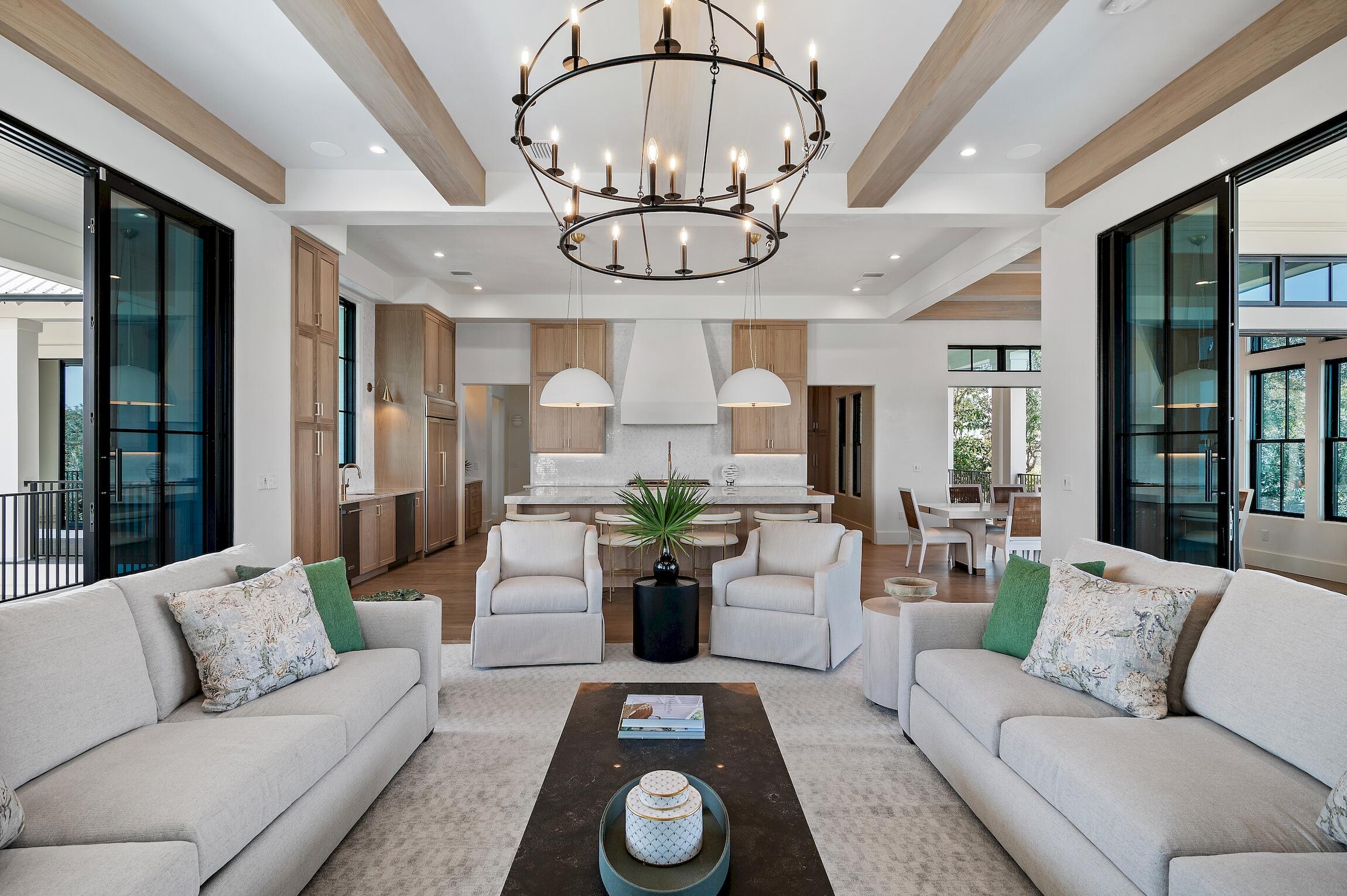 a living room with furniture a chandelier and a chandelier