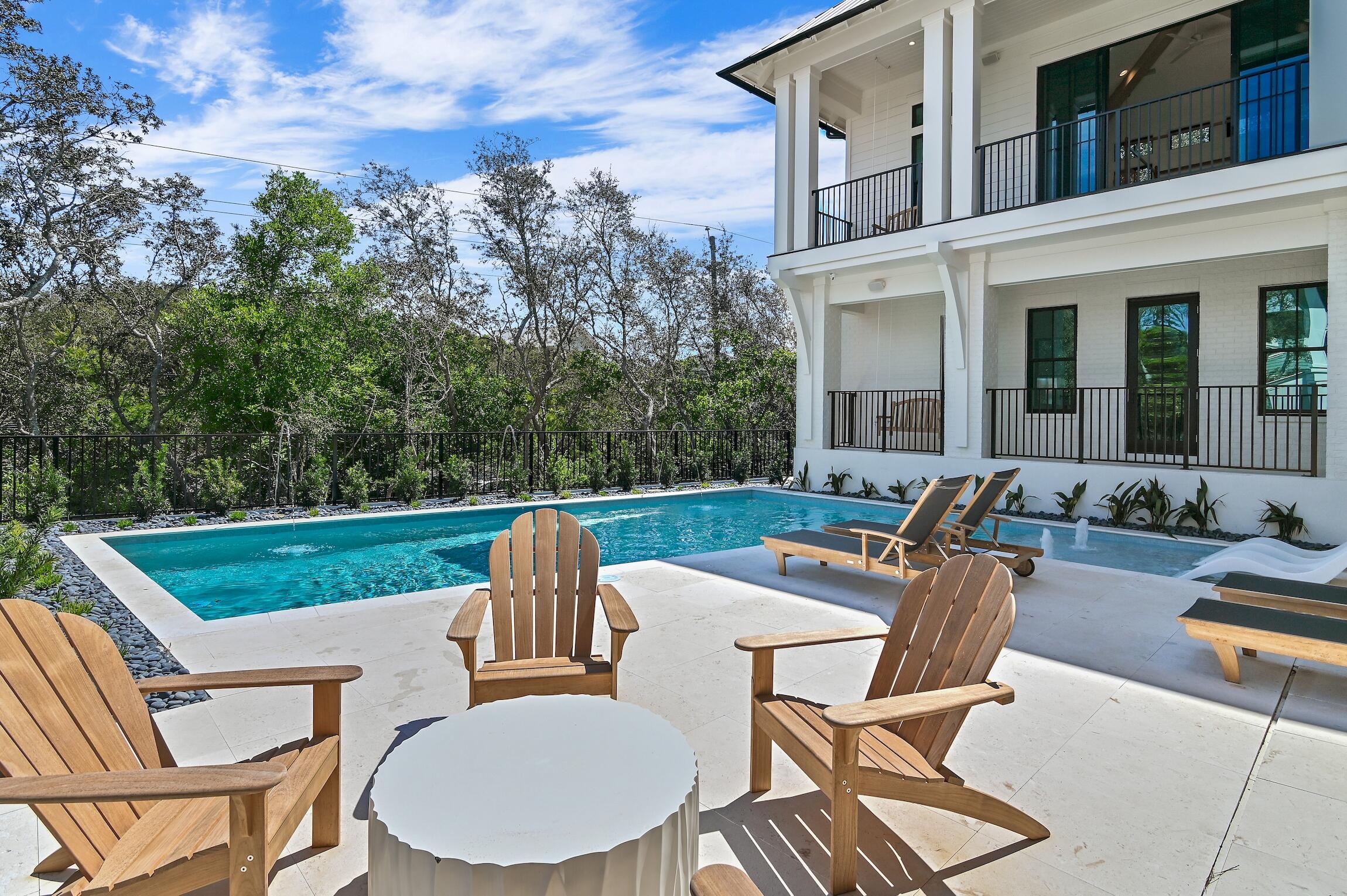 102 Bullard Road Santa Rosa Beach, FL 32459 - Photo 19 of 63 a view of a patio with a table chairs and a backyard