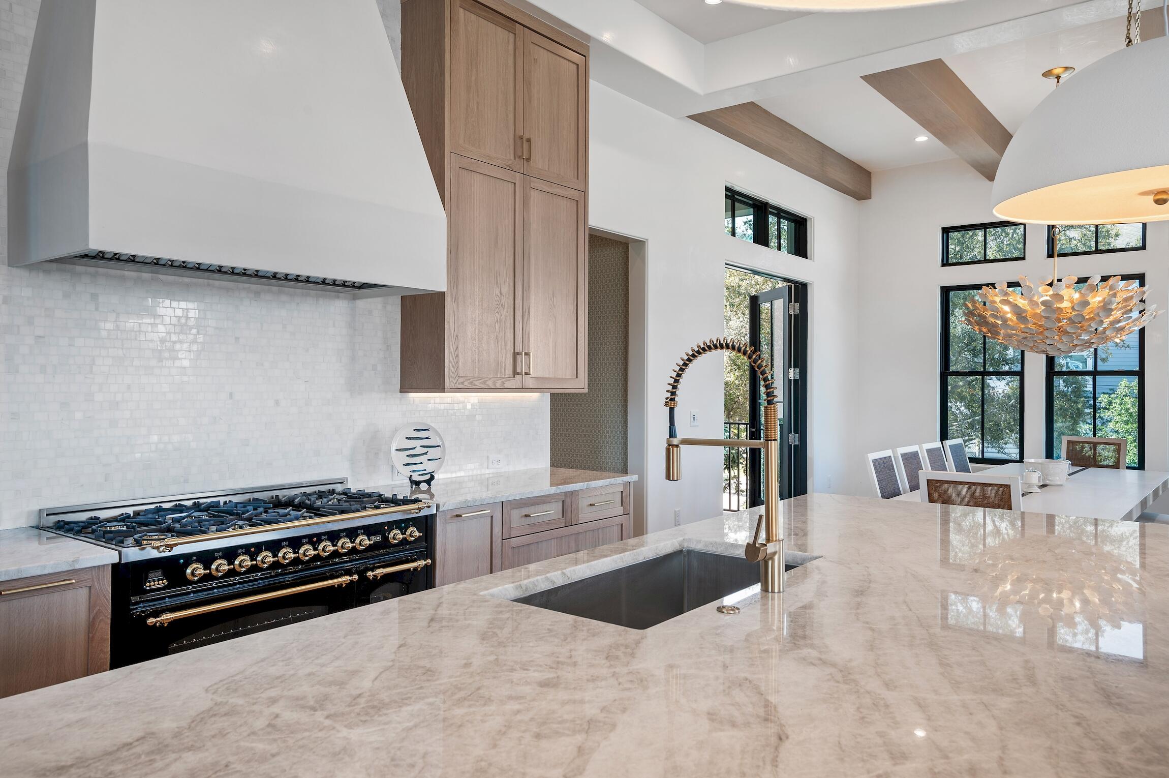 102 Bullard Road Santa Rosa Beach, FL 32459 - Photo 22 of 63 a kitchen with stainless steel appliances a stove and a sink