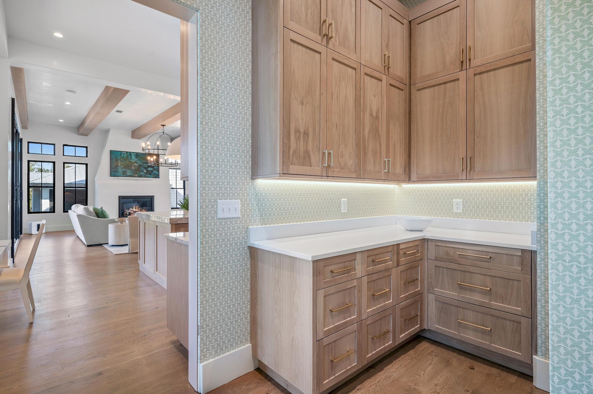 102 Bullard Road Santa Rosa Beach, FL 32459 - Photo 24 of 63 a kitchen with a white cabinets and chandelier