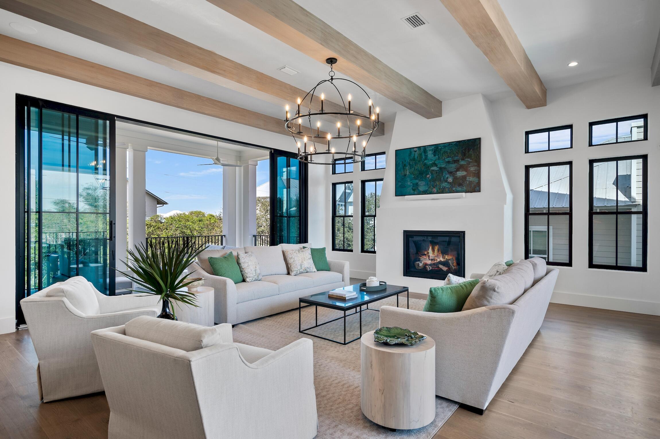 102 Bullard Road Santa Rosa Beach, FL 32459 - Photo 26 of 63 a living room with furniture a chandelier and a fireplace