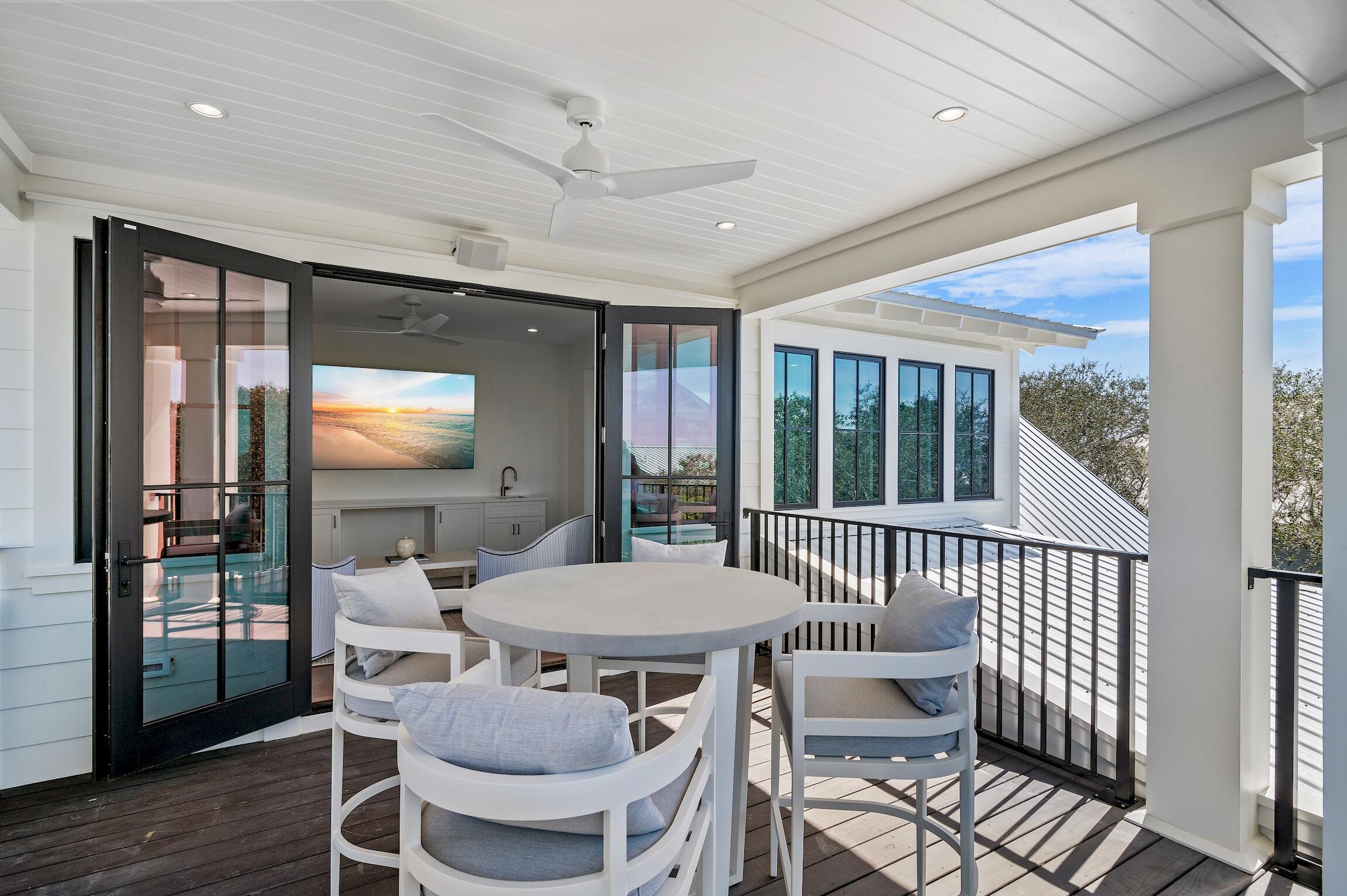 102 Bullard Road Santa Rosa Beach, FL 32459 - Photo 33 of 63 a view of a dining room with furniture window and wooden floor