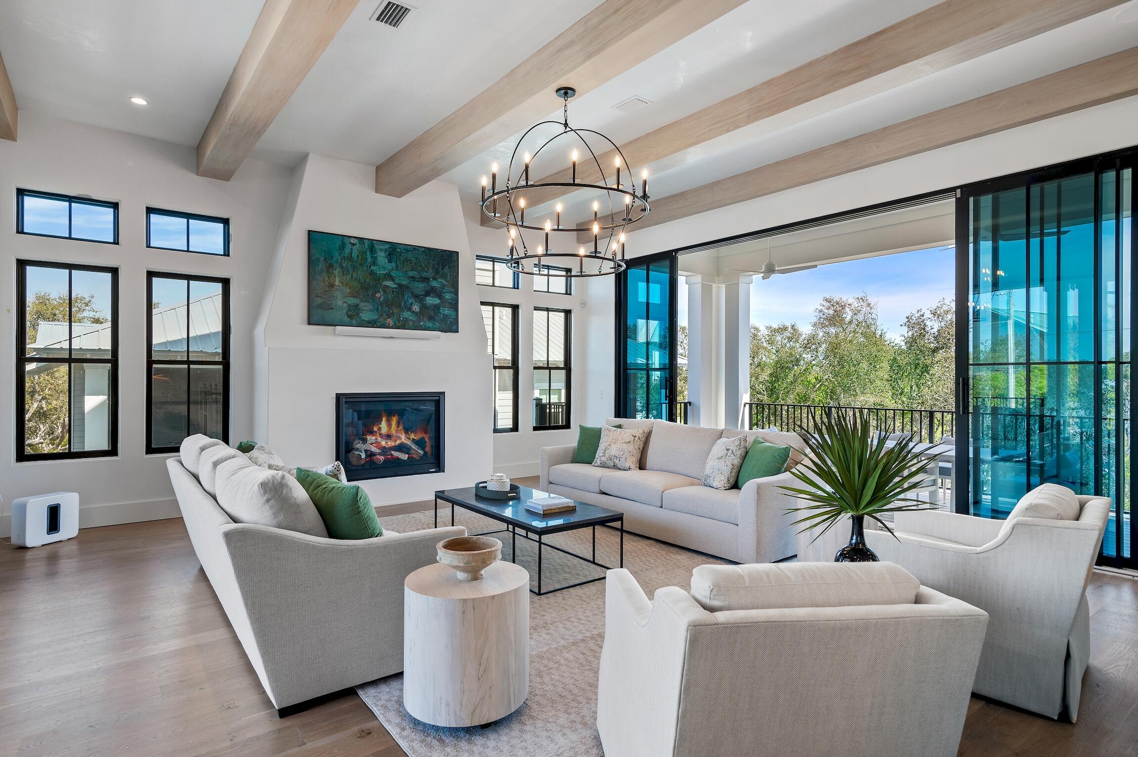 102 Bullard Road Santa Rosa Beach, FL 32459 - Photo 5 of 63 a living room with furniture a chandelier and a large window