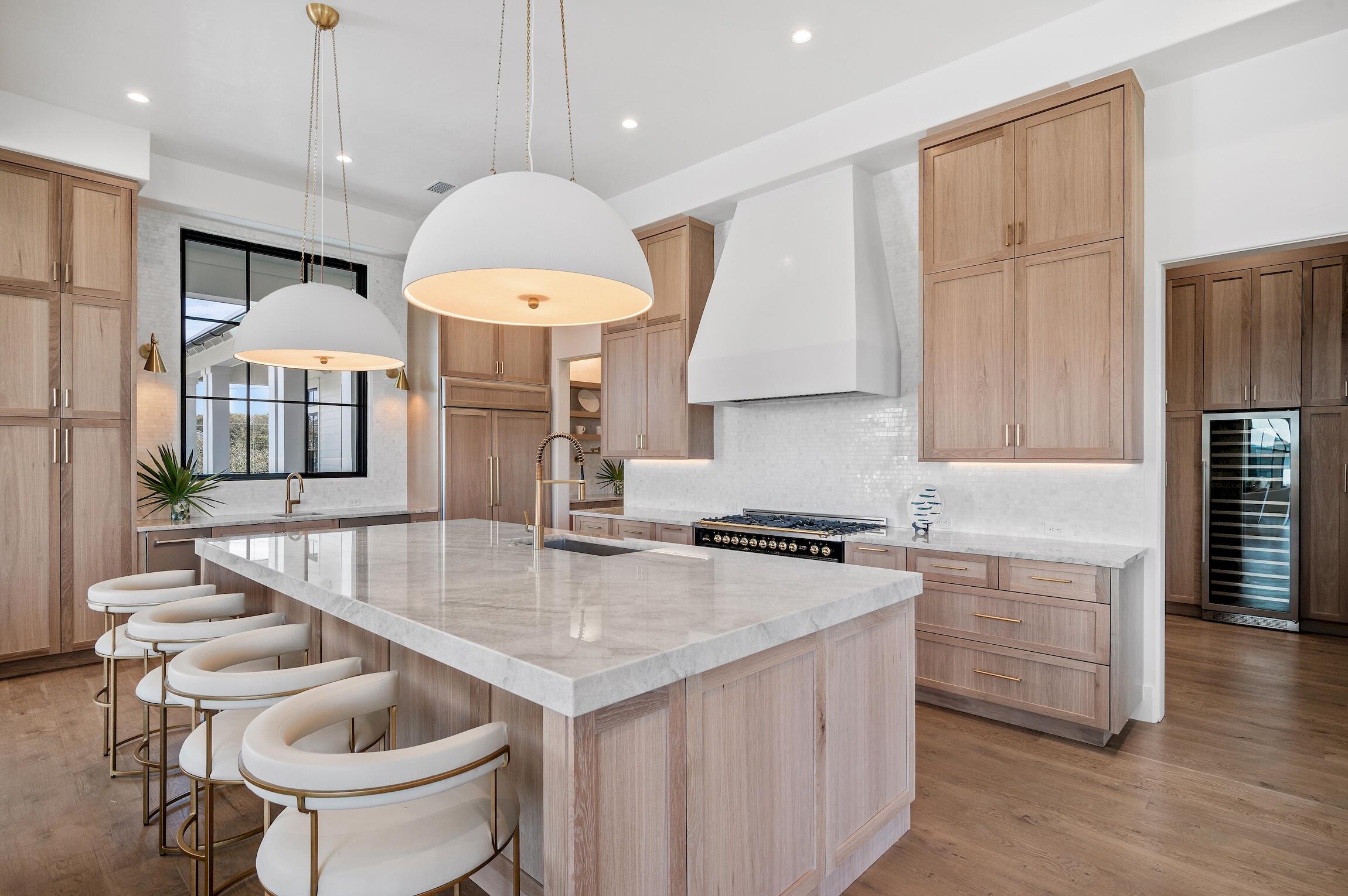 102 Bullard Road Santa Rosa Beach, FL 32459 - Photo 8 of 63 a kitchen with stainless steel appliances granite countertop a sink a stove and a refrigerator