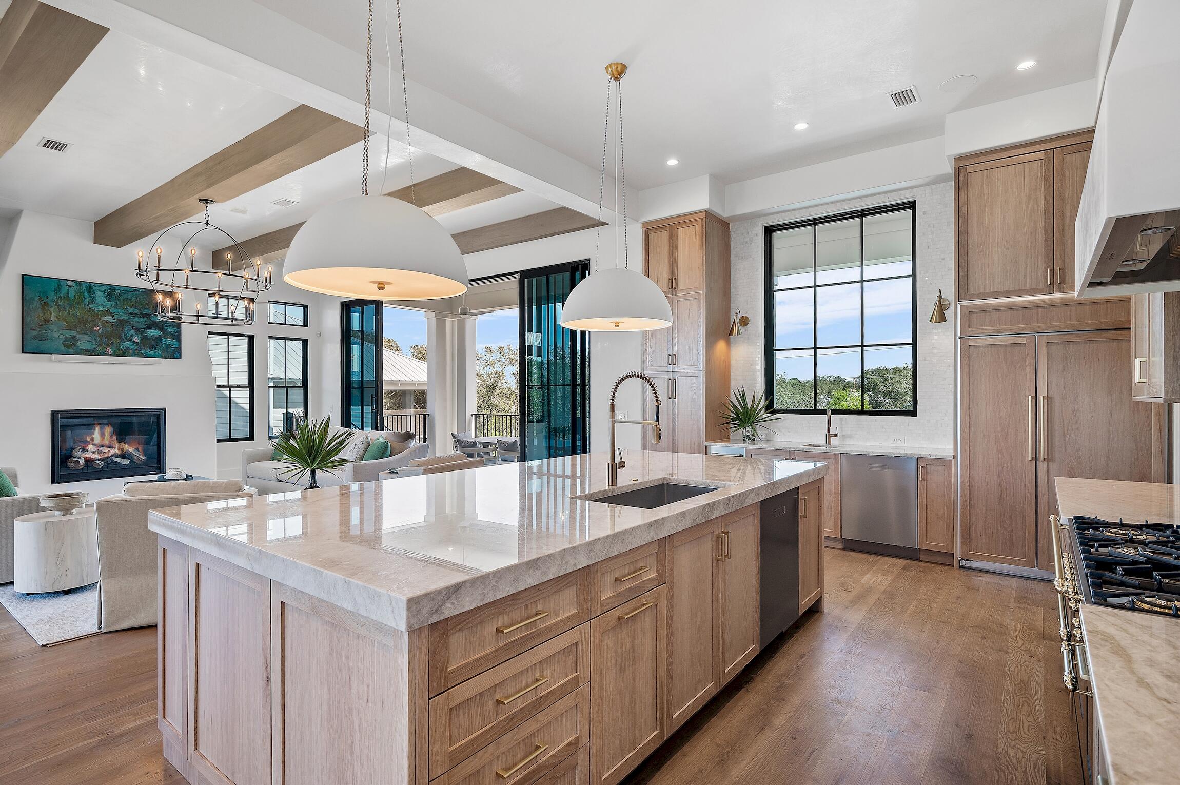 102 Bullard Road Santa Rosa Beach, FL 32459 - Photo 9 of 63 a large kitchen with kitchen island a sink appliances and a large window