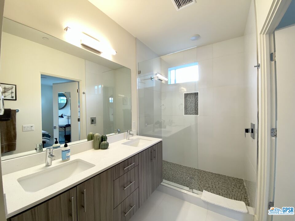 158 The River Palm Springs, CA 92262 - Photo 11 of 17 a bathroom with a double vanity sink mirror and shower