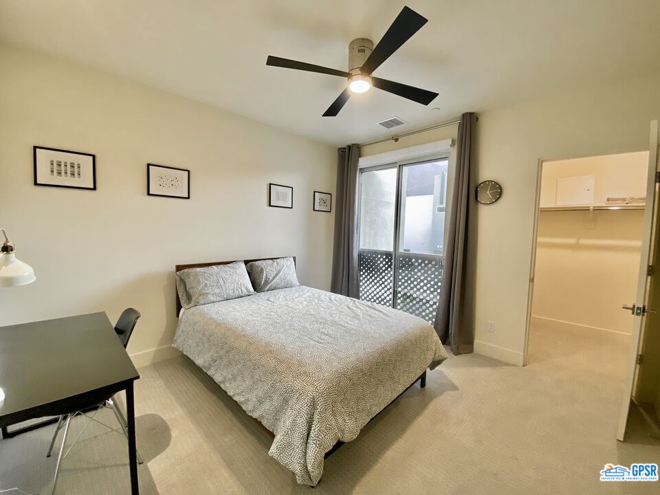 158 The River Palm Springs, CA 92262 - Photo 12 of 17 a bedroom with a bed bathroom and a desk