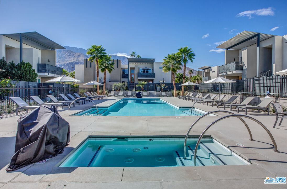158 The River Palm Springs, CA 92262 - Photo 16 of 17 a swimming pool with outdoor seating and yard