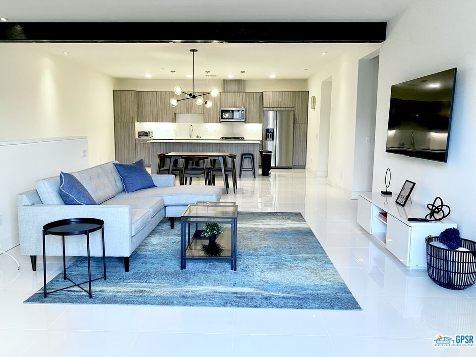 158 The River Palm Springs, CA 92262 - Photo 5 of 17 a living room with furniture and a flat screen tv