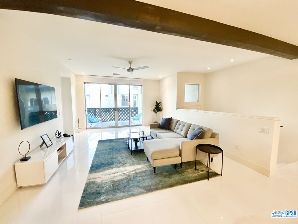 158 The River Palm Springs, CA 92262 - Photo 6 of 17 a living room with furniture and a flat screen tv