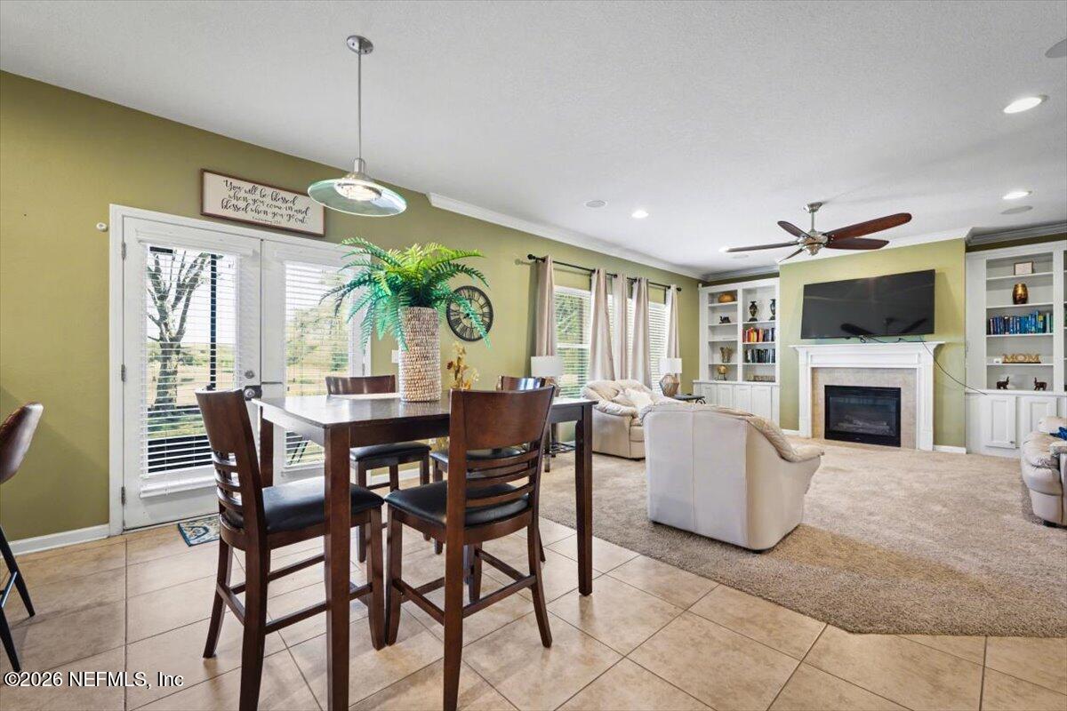 8131 Broward Cove Road Jacksonville, FL 32218 - Photo 13 of 35 a view of a dining room with furniture window and wooden floor