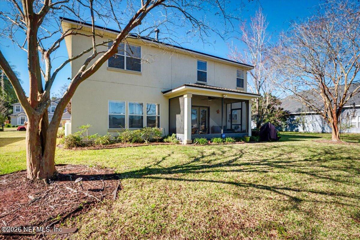 8131 Broward Cove Road Jacksonville, FL 32218 - Photo 15 of 35 a front view of a house with a yard