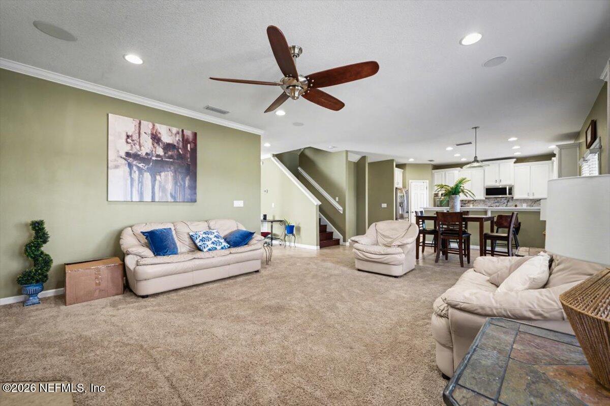 8131 Broward Cove Road Jacksonville, FL 32218 - Photo 16 of 35 a living room with furniture and kitchen view