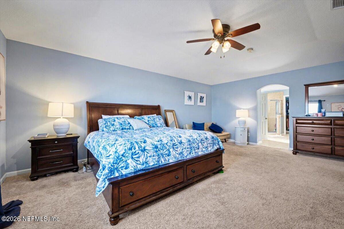 8131 Broward Cove Road Jacksonville, FL 32218 - Photo 31 of 35 a bedroom with a bed and dresser