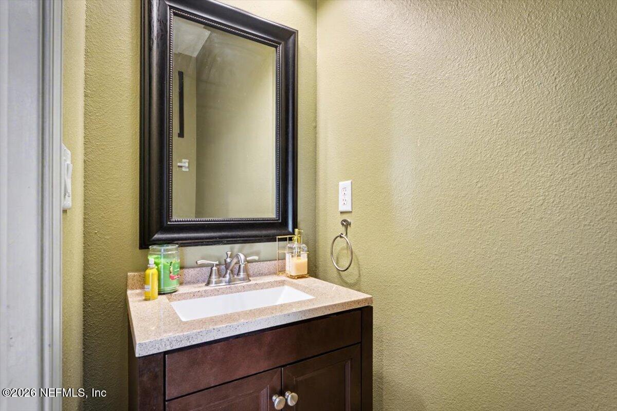 8131 Broward Cove Road Jacksonville, FL 32218 - Photo 5 of 35 a bathroom with a sink and a mirror